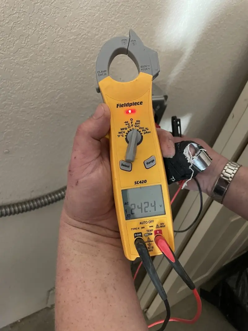 Voltage testing with clamp meter during Outlet Installation in Kingsville